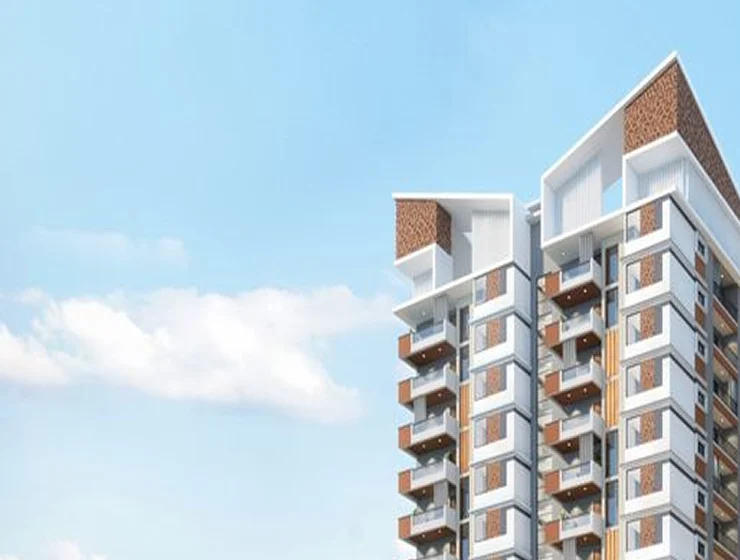 A high-rise apartment tower against an open sky